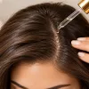 Cica peptide scalp treatment applied along the hair part